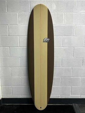 OM mini mal 7'2 custom dimensions in brown with a white stripe in the middle of the board