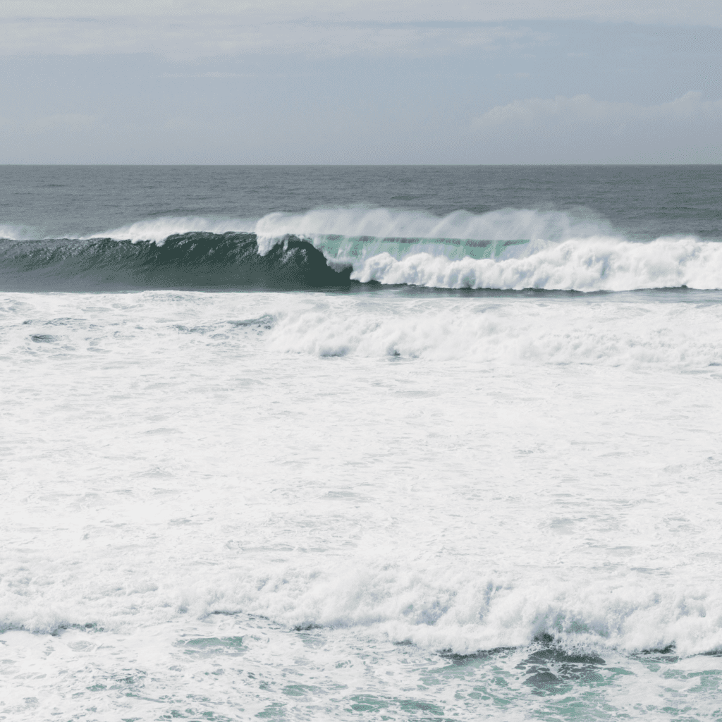 big breaking wave with sea foam