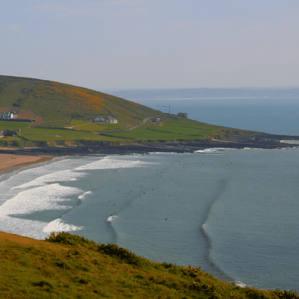 area view of croyde beach and people surfing