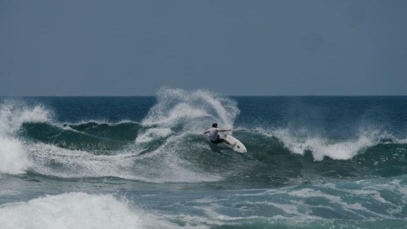 man surfing large wave